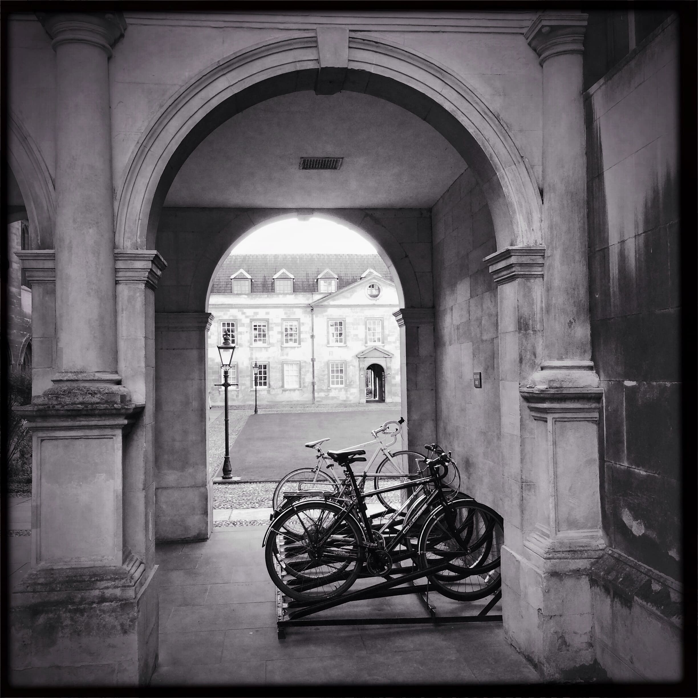 Several bicycles parked at a bicycle rack.